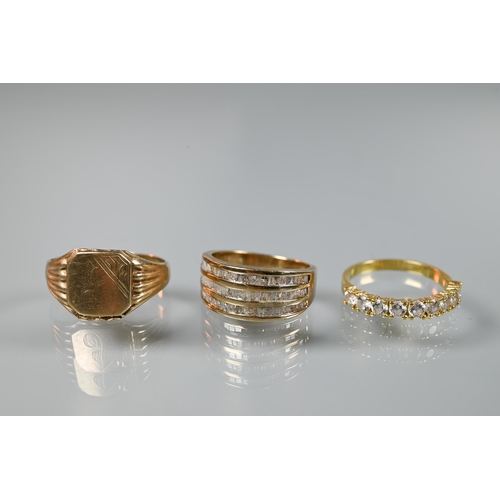 197 - A 9ct yellow gold ring set three rows of channel set diamonds, size O; a 9ct yellow gold signet ring... 