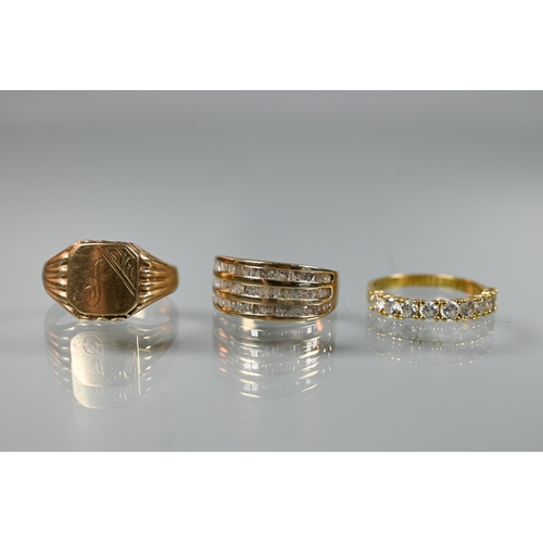 197 - A 9ct yellow gold ring set three rows of channel set diamonds, size O; a 9ct yellow gold signet ring... 