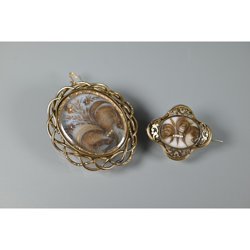 199 - Two Victorian gilt metal oval mourning brooches, both with hairwork panels, 6.5 x 5.5 cm and 3.5 x 4... 