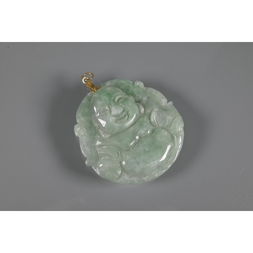 201 - Two carved jade pendants, one in the form of a Buddha, the other a fish and lotus leaf, a jade round... 