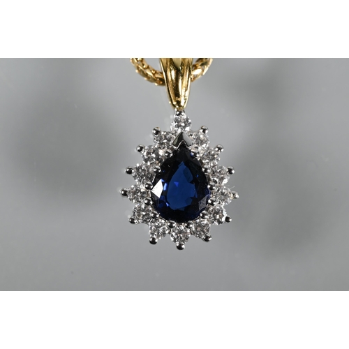 202 - A sapphire and diamond cluster pendant of tear-shaped form, 18ct yellow and white gold set, on 18ct ... 