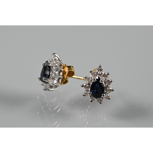 202 - A sapphire and diamond cluster pendant of tear-shaped form, 18ct yellow and white gold set, on 18ct ... 