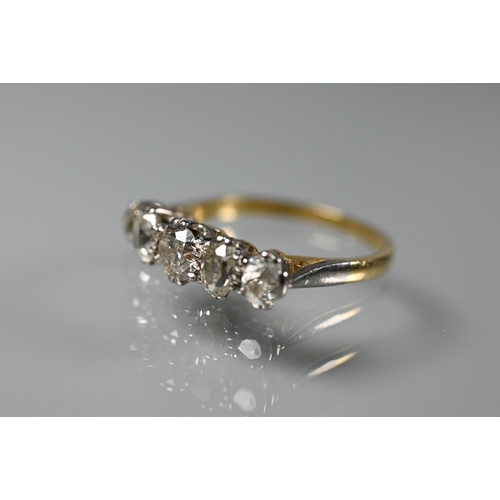 203 - A five stone diamond ring, the alternate oval and round diamonds in yellow and white metal setting s... 