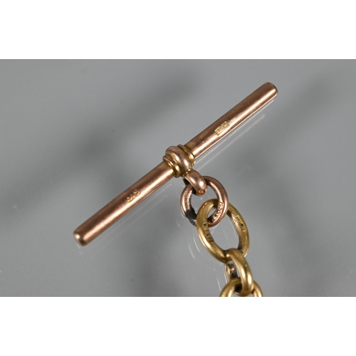 204 - A 1963 gold sovereign in 9ct scroll mount, on 9ct yellow gold part chain with 9ct rose gold bar atta... 