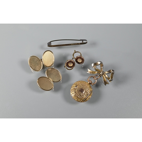 217 - A pair of 9ct yellow gold oval cufflinks, 14.2g a bar brooch stamped 9ct and silver, a round locket ... 