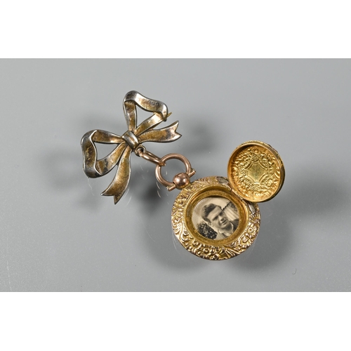 217 - A pair of 9ct yellow gold oval cufflinks, 14.2g a bar brooch stamped 9ct and silver, a round locket ... 