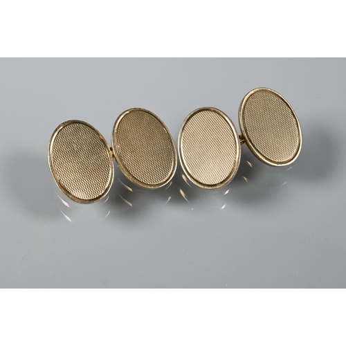 217 - A pair of 9ct yellow gold oval cufflinks, 14.2g a bar brooch stamped 9ct and silver, a round locket ... 