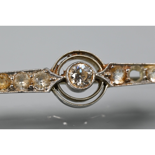 218 - A 1920s diamond set bar brooch, white metal stamped 18ct plat, 6 cm long, 4.2g all in (stone missing... 