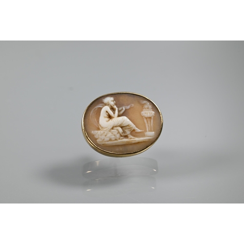 219 - A pair of cameo oval plaques featuring classical scenes, set as earrings in unmarked yellow metal to... 