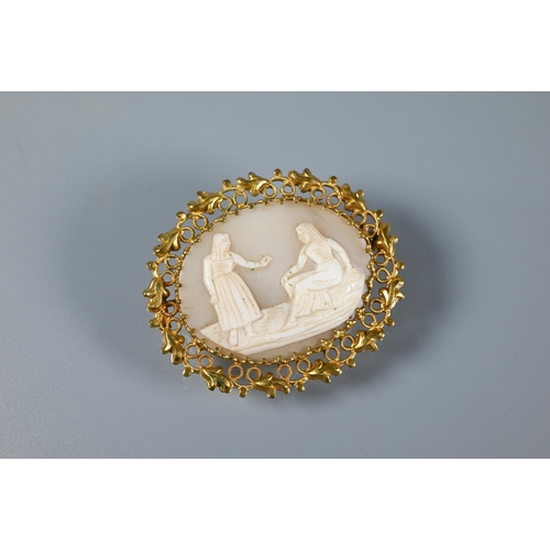 220 - A pale carved cameo shell brooch featuring two figures in decorative gilt metal surround to/w a carv... 