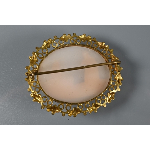 220 - A pale carved cameo shell brooch featuring two figures in decorative gilt metal surround to/w a carv... 