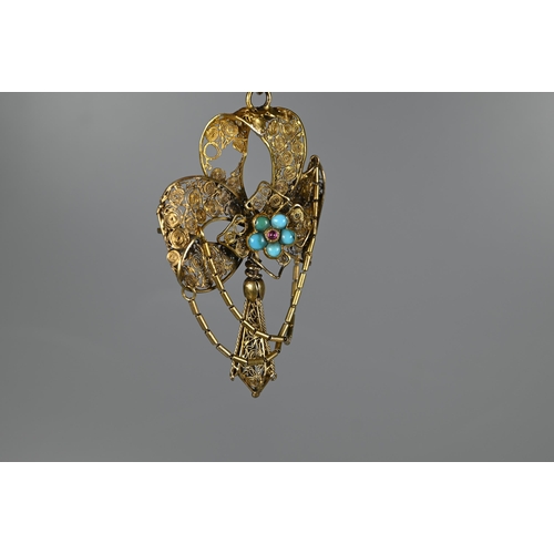 225 - An antique yellow metal filigree pendant, with central turquoise and garnet set cluster, a/f