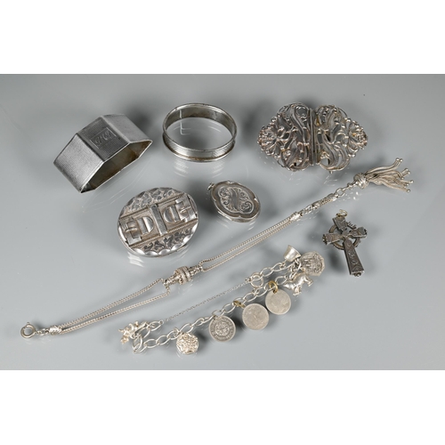 226 - A white metal curb bracelet with eight charms attached, a sterling chatelaine, silver locket now a b... 