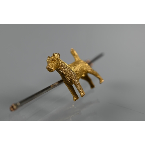 227 - A 9ct bar brooch featuring terrier stamped 15ct, 5cm long, approx 6.6g all in