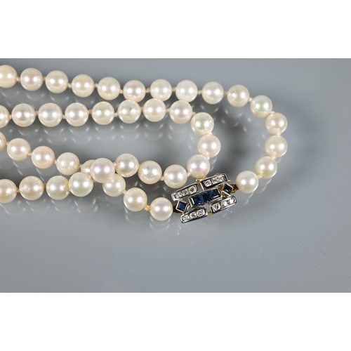 229 - A row of uniform cultured Akoya pearls 93 cm long knotted throughout onto Art Deco style sapphire an... 