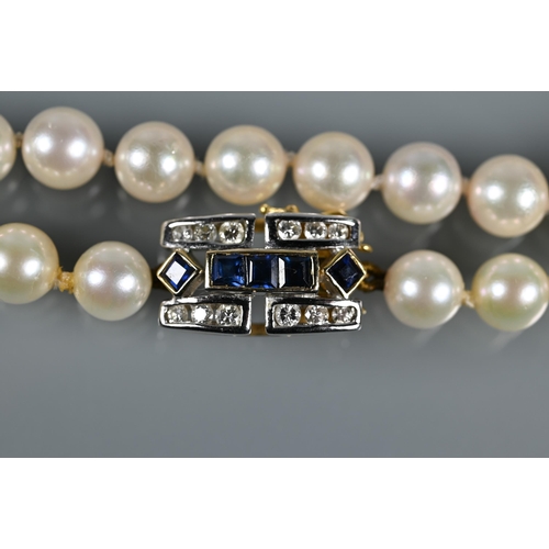 229 - A row of uniform cultured Akoya pearls 93 cm long knotted throughout onto Art Deco style sapphire an... 