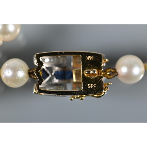 229 - A row of uniform cultured Akoya pearls 93 cm long knotted throughout onto Art Deco style sapphire an... 