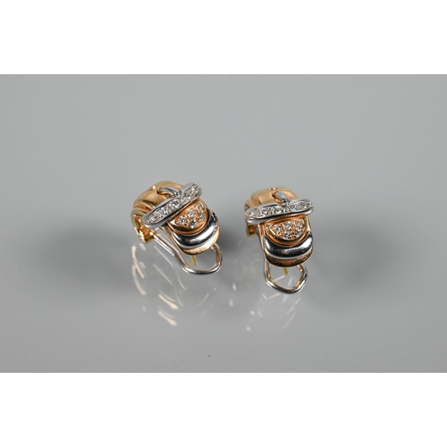 235 - A pair of Italian diamond-set half-hoop earrings in the form of a buckle, yellow and white metal set... 