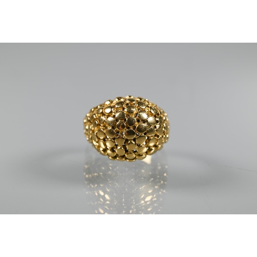 237 - A contemporary bombé ring of textured from, yellow metal stamped 750, size M, approx 7.5g