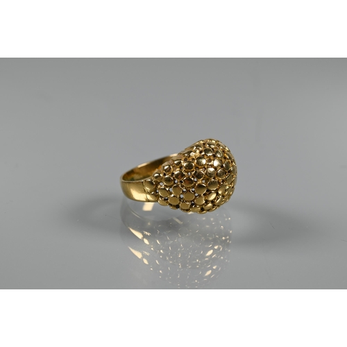 237 - A contemporary bombé ring of textured from, yellow metal stamped 750, size M, approx 7.5g