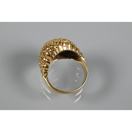 237 - A contemporary bombé ring of textured from, yellow metal stamped 750, size M, approx 7.5g