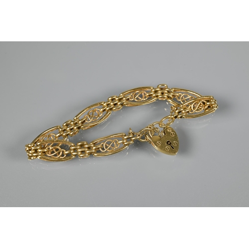 238 - An 18ct yellow gold fancy link bracelet with padlock and safety chain attached, approx 21.8g