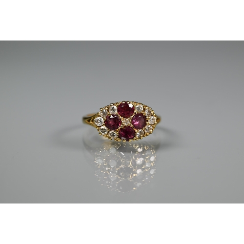 243 - An antique garnet and diamond cluster ring formed of four circular garnets with eleven diamonds arou... 