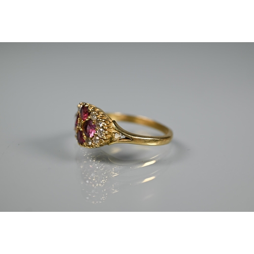 243 - An antique garnet and diamond cluster ring formed of four circular garnets with eleven diamonds arou... 