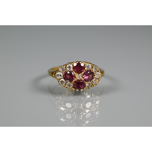 243 - An antique garnet and diamond cluster ring formed of four circular garnets with eleven diamonds arou... 