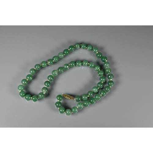 244 - A row of uniform jade beads, knotted onto yellow metal clasp marked silver; an Italian micro mosaic ... 