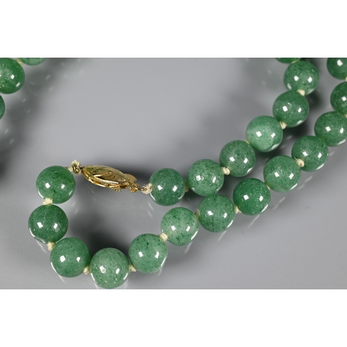 244 - A row of uniform jade beads, knotted onto yellow metal clasp marked silver; an Italian micro mosaic ... 