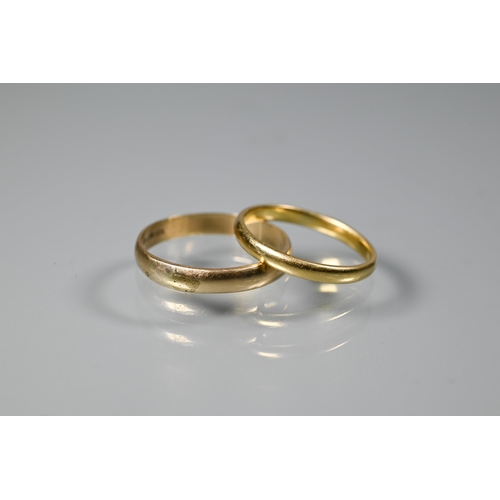 257 - Two yellow gold wedding bands, 18ct size N, 2.3g and 9ct size S (evidence of re-sizing), 2g