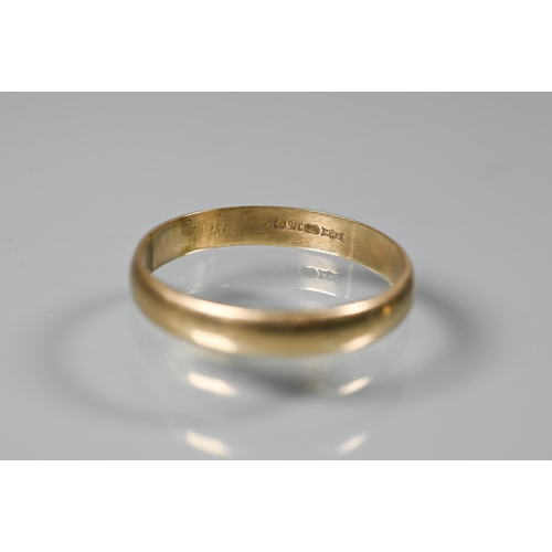 257 - Two yellow gold wedding bands, 18ct size N, 2.3g and 9ct size S (evidence of re-sizing), 2g