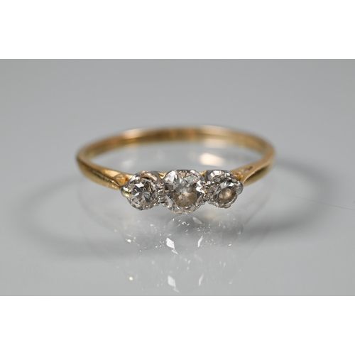 258 - A graduated three stone diamond ring, yellow metal set, size S and a single stone diamond ring, size... 