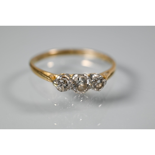 258 - A graduated three stone diamond ring, yellow metal set, size S and a single stone diamond ring, size... 