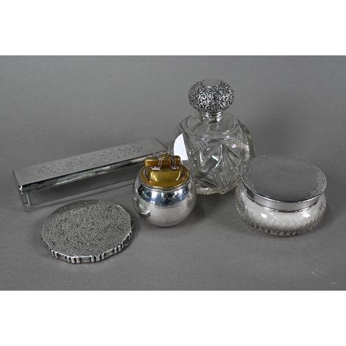 26 - A weighted silver 'Witchball' table lighter, William Comyns & Sons Ltd, London 1957, a cut glass... 