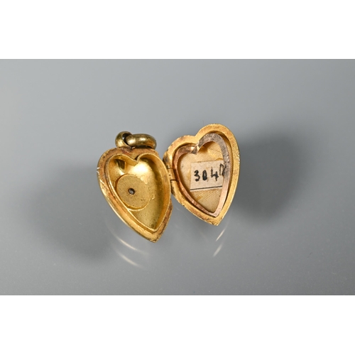 264 - A Victorian 15ct heart-shaped pendant set diamond, 2.2cm drop including hanger to/w a 9ct Prince of ... 