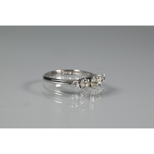 273 - A five stone half hoop diamond ring, the graduated stones claw set in white metal stamped plat, size... 