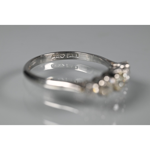 273 - A five stone half hoop diamond ring, the graduated stones claw set in white metal stamped plat, size... 