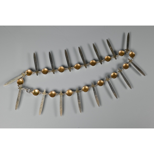 275 - David Andersen - A Norwegian silver-gilt and white enamel fringe necklace formed of alternate rounde... 