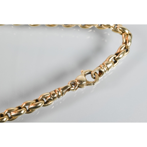 276 - A yellow gold curb link Albert chain, swivel marked 18ct, clasp marked for 9ct, 46 cm long (open), a... 