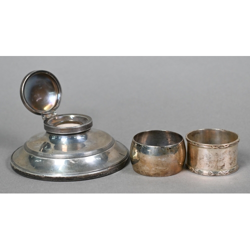 28 - A set of four silver shell salts, Sheffield 1912, to/w two pairs of salt spoons, two napkin rings, a... 