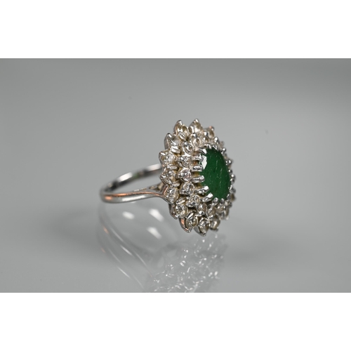 284 - An emerald and diamond cluster ring, the oval emerald with two rows of diamonds around, 18ct white g... 