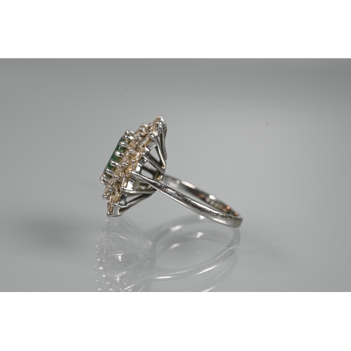 284 - An emerald and diamond cluster ring, the oval emerald with two rows of diamonds around, 18ct white g... 