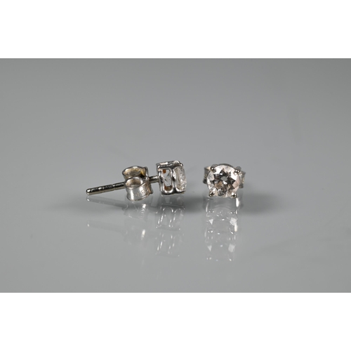 286 - A pair of diamond-stud earrings for pierced ears, each diamond approx 0.4 carats, white metal set