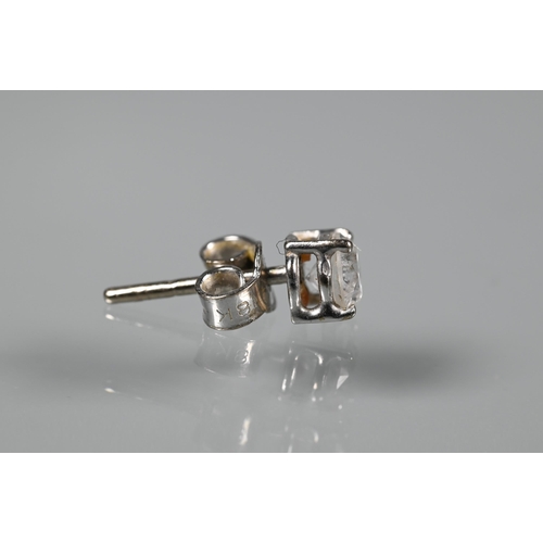 286 - A pair of diamond-stud earrings for pierced ears, each diamond approx 0.4 carats, white metal set