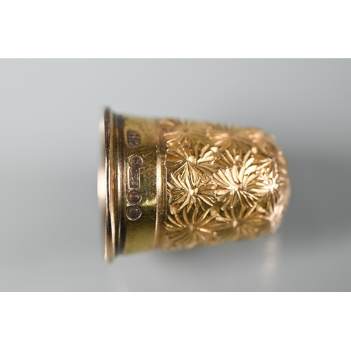 287A - A Victorian 15ct yellow gold thimble with chased decoration, 4.3g