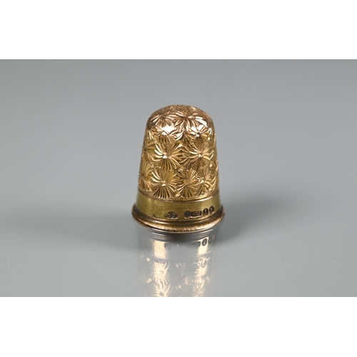 287A - A Victorian 15ct yellow gold thimble with chased decoration, 4.3g