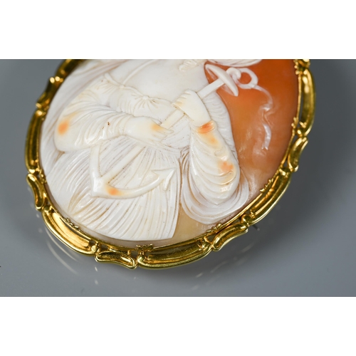 288 - A large Victorian cameo brooch featuring St Philomena, in yellow metal scroll mount, 6.5 x 5.5 cm