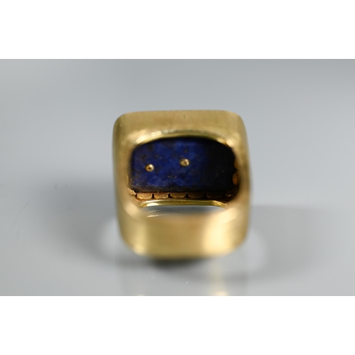 292 - Andrew Grima (1921-2007) - An 18ct textured and bloomed ring with lapis lazuli plaque with diamond-s... 